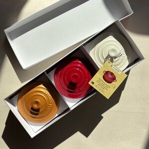 Le Creuset Mini Cocotte Set in Gold, Red, and White